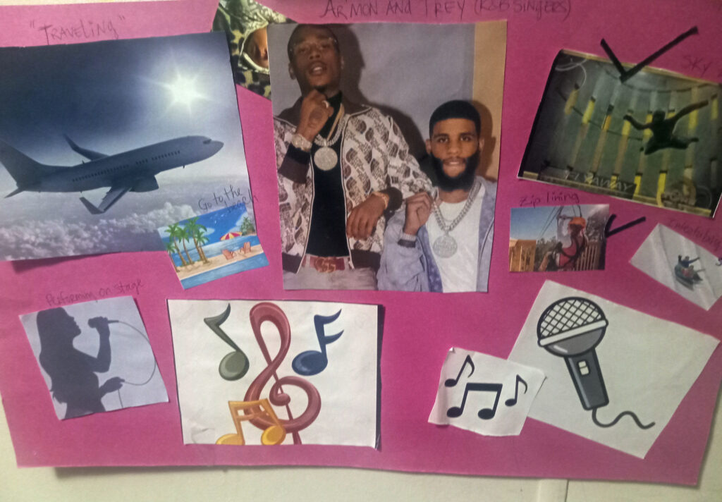 Poster board with pasted pictures of an airplane, music notes, indoor sky diving, a beach, a zip line, and musicians. Text: Traveling, Armon and Trey (Singers), Performing on Stage, Zip Lining